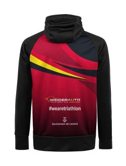 Jaqueta esportiva unisex amb butxaques i opció de personalització parcial. Disponible en model amb caputxa.